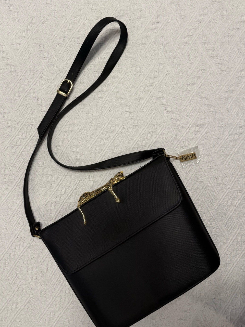 Nima Black Crossbody with Gold Hardware and Logo Charm